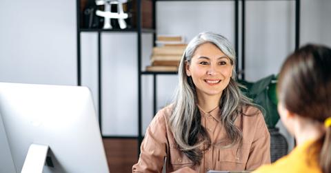 Mature Asian Woman, HR Manager, Office, Resume, Smiling