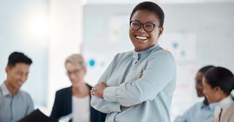 Black woman, leader and business executive laughing and happy about corporate success, profit and growth development. Female entrepreneur in management, motivation and vision strategy meeting