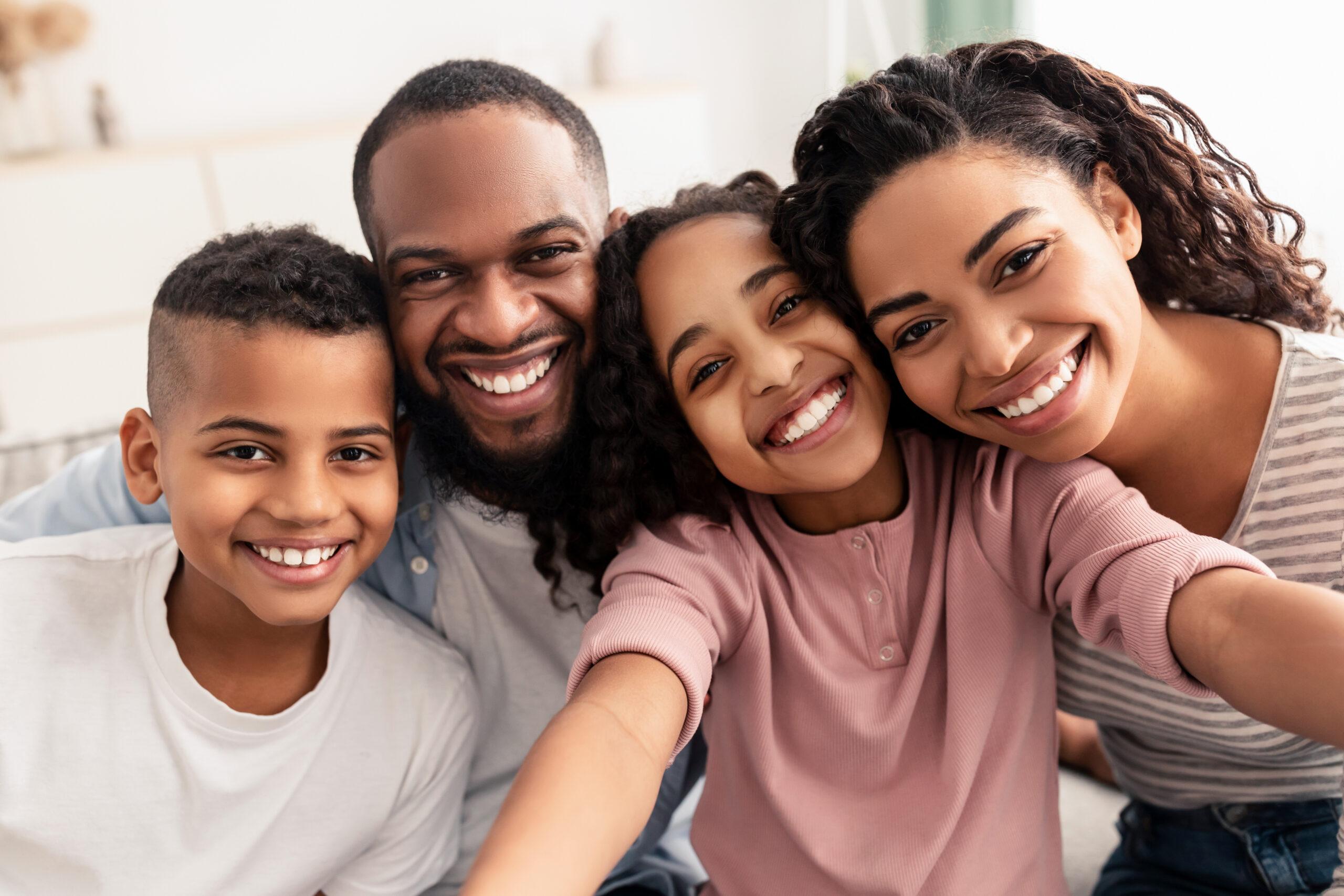 Portrait of african american family taking a selfie together at home