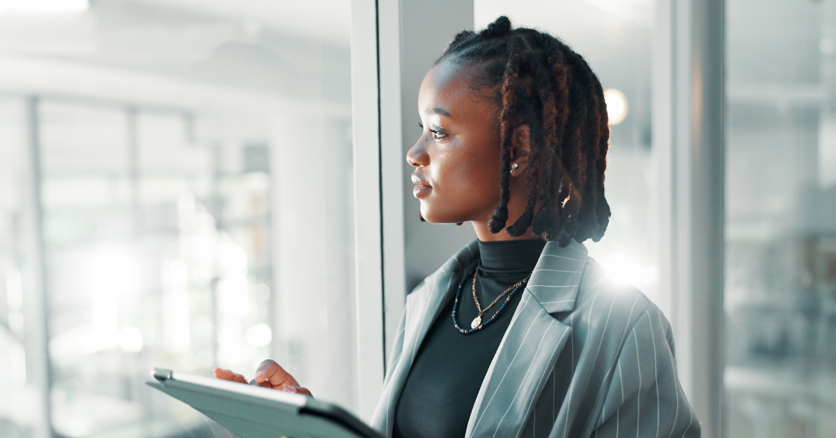 Woman in suit reflecting