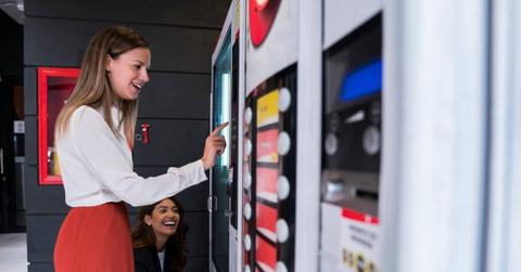 imgi_12_women-co-workers-are-at-work-break-using-coworking-office-vending-machine