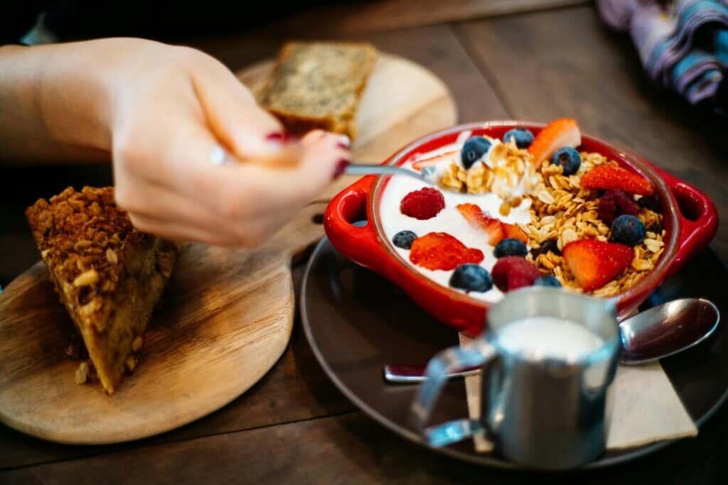 Woman eating healthy yogurt bowl