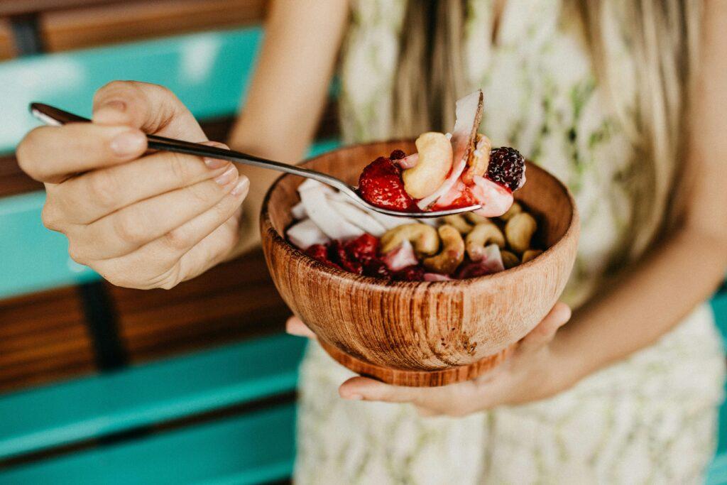 Woman eating yogurt bowl