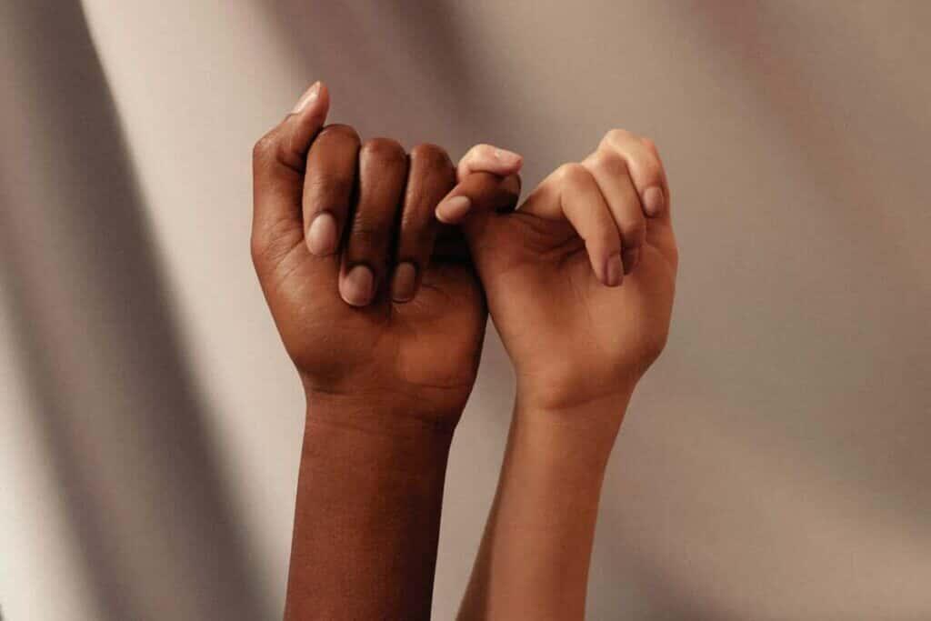 two hands pinky swearing