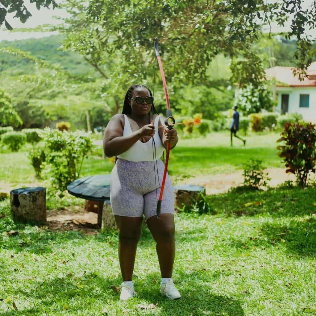 woman in spring with an archery bow