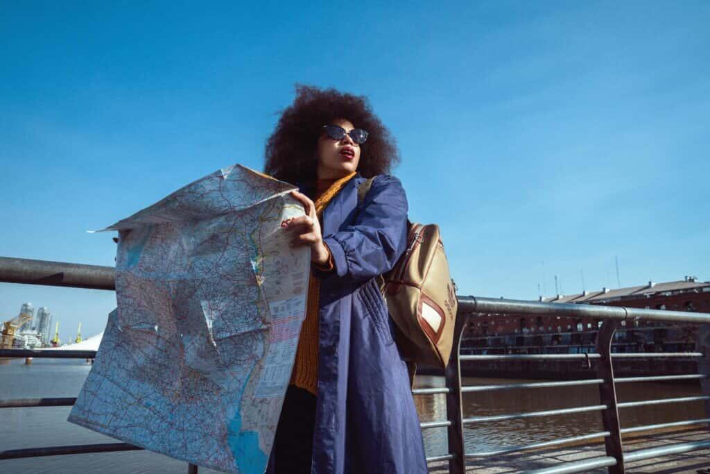 Woman travelling looking at map