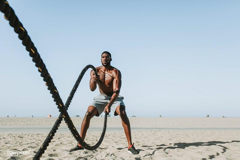 man swinging rope