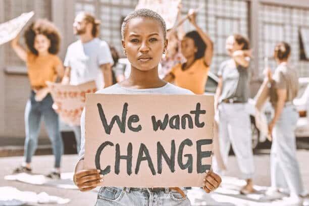 ///imgi__black woman protest group and sign about peace justice and gender equality in sa for