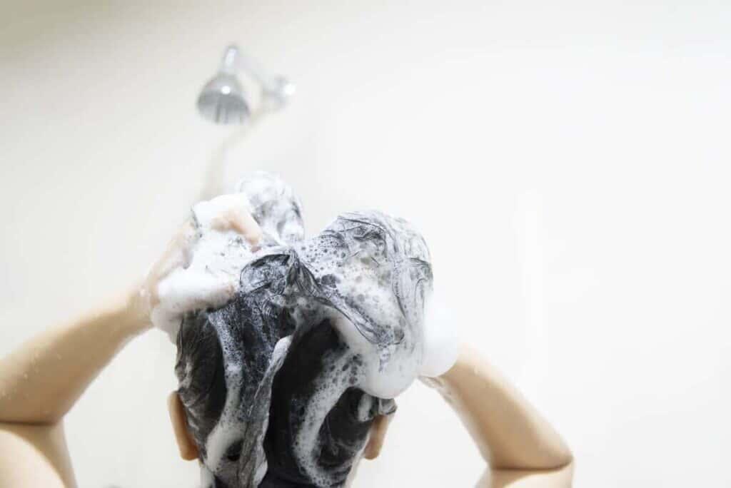 ///lady using shampoo wash clean her hair bathroom with splash shower spray water x