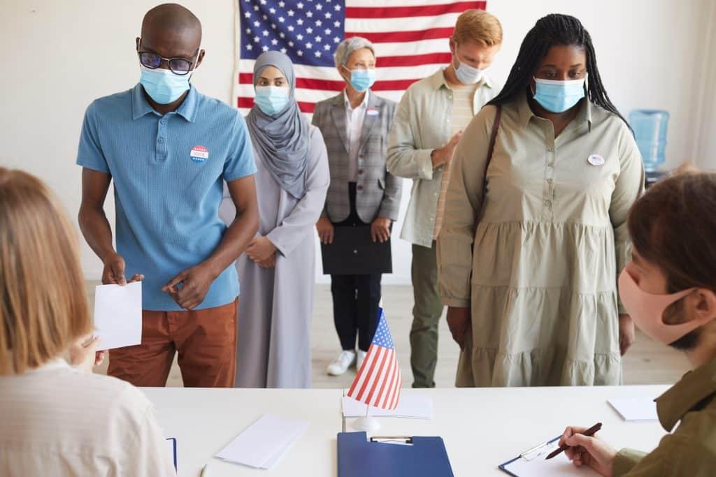 Voters Wearing Masks Everything You Need To Know About New York City's Upcoming Local Election at Polling Station