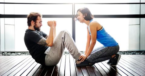 Couple exercising together sit ups