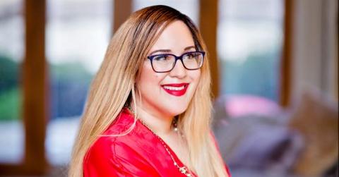 Nicole Moore wearing holiday colors