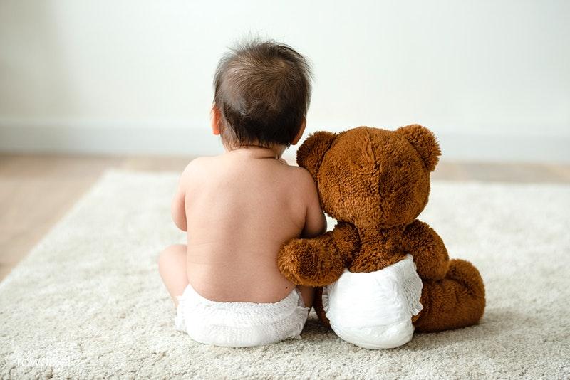 Baby with a teddy bear