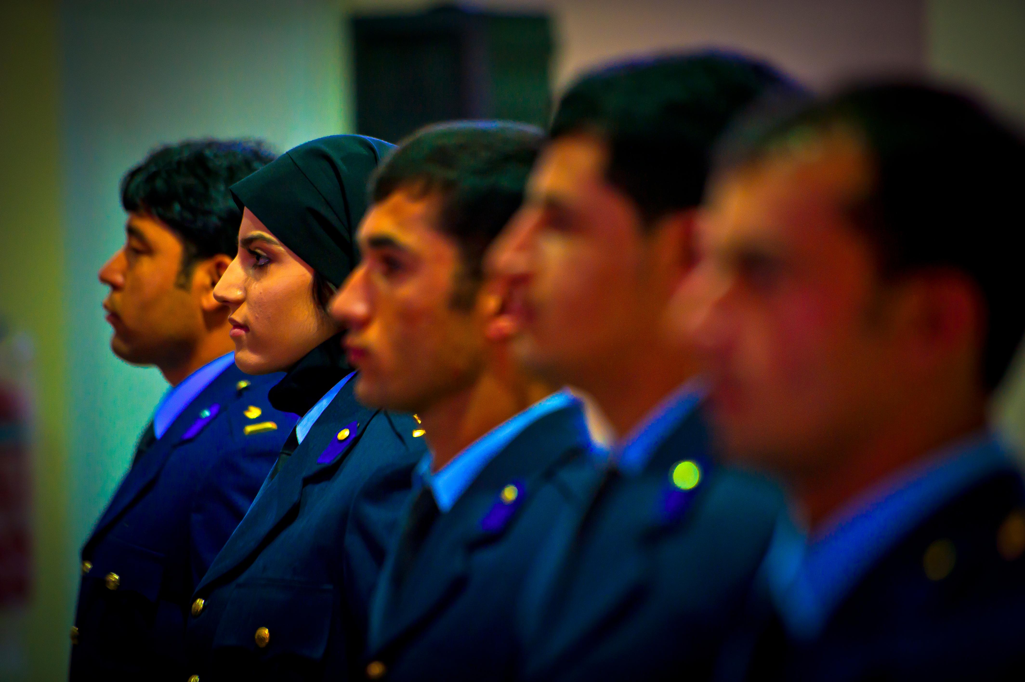 Afghan air force 2nd Lt. Niloofar Rhmani stands alongside the other four graduates of undergraduate pilot training just prior to receiving their pilot wings at a ceremony May 14, 2013, at Shindand Air Base, Afghanistan. Rhmani made history May 14, 2013, when she became the first female to successfully complete undergraduate pilot training and earn the status of pilot in more than 30 years. She will continue her service as she joins the Kabul Air Wing as a Cessna 208 pilot. (U.S. Air Force photo/ Senior Airman Scott Saldukas)